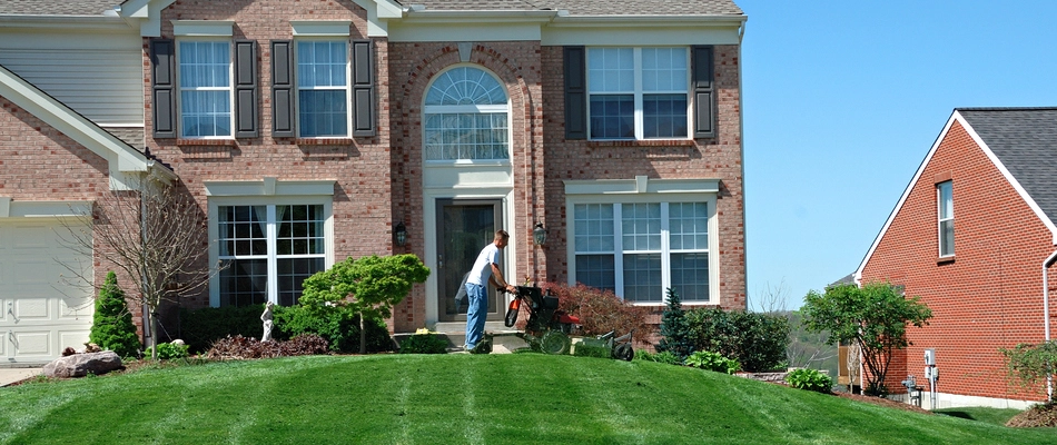 A homeowner in Chantilly, VA mowing his lawn.
